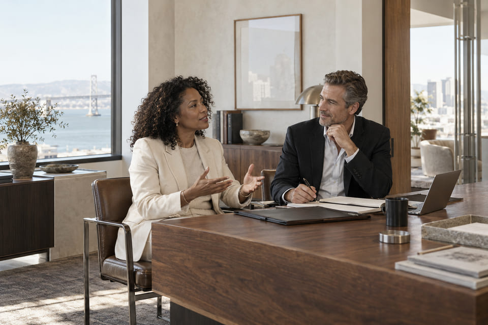 Illustrative scene of two financial professionals in a working conversation